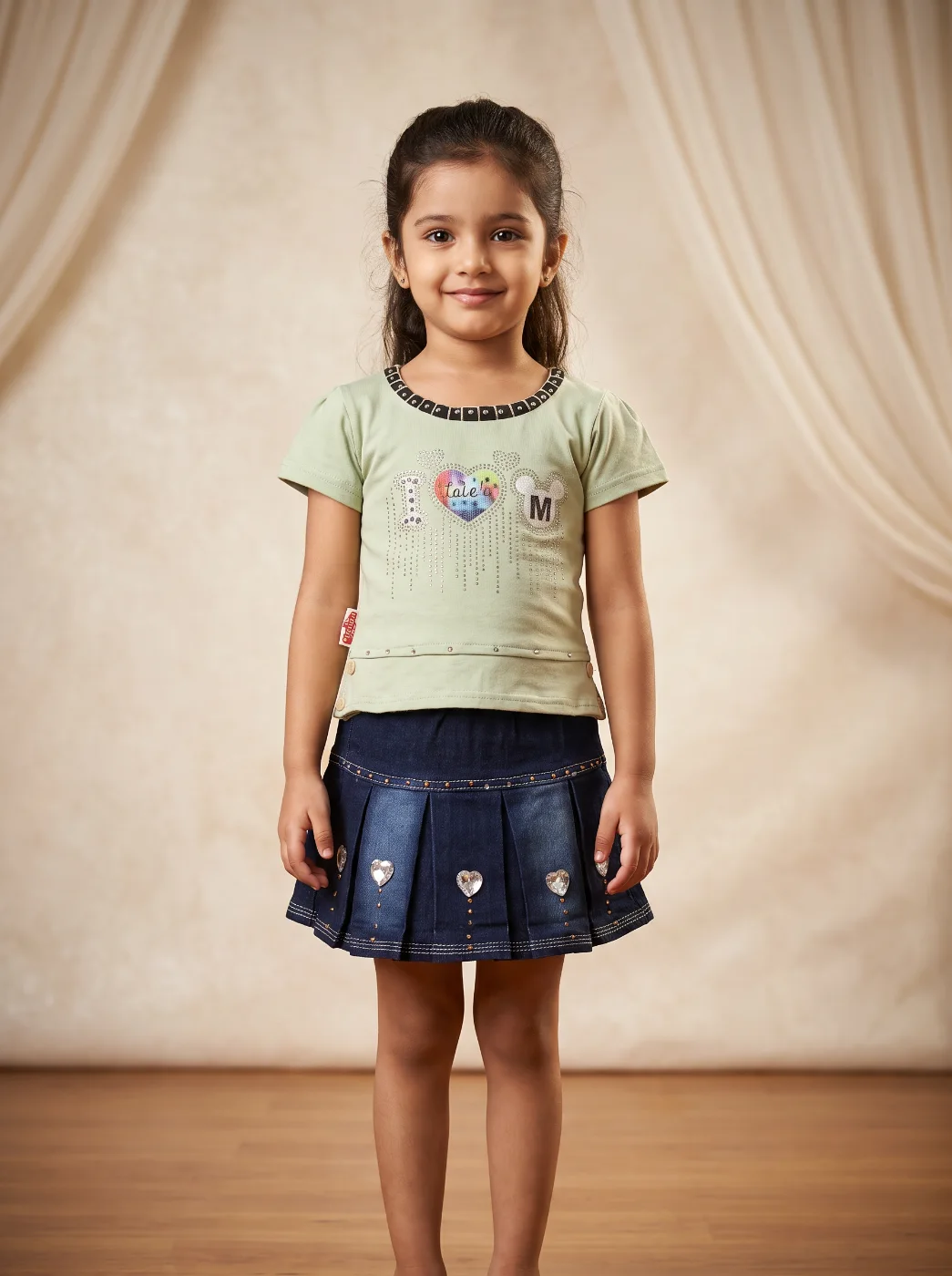 Otrada Girls Embellished Light Green T-Shirt & Dark Blue Denim Pleated Skirt Set