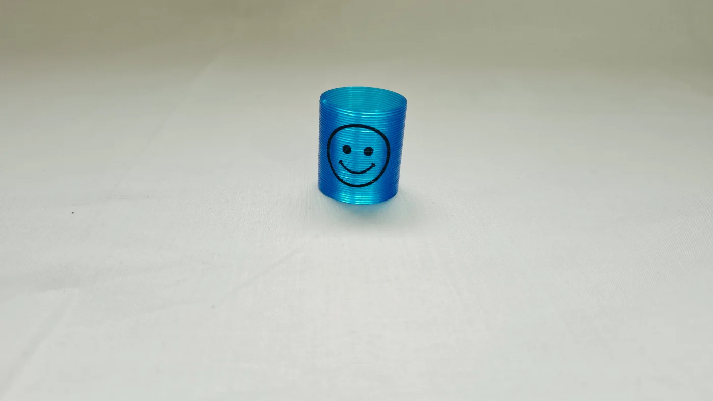 Blue Slinky Spring Toy with Smiley Face