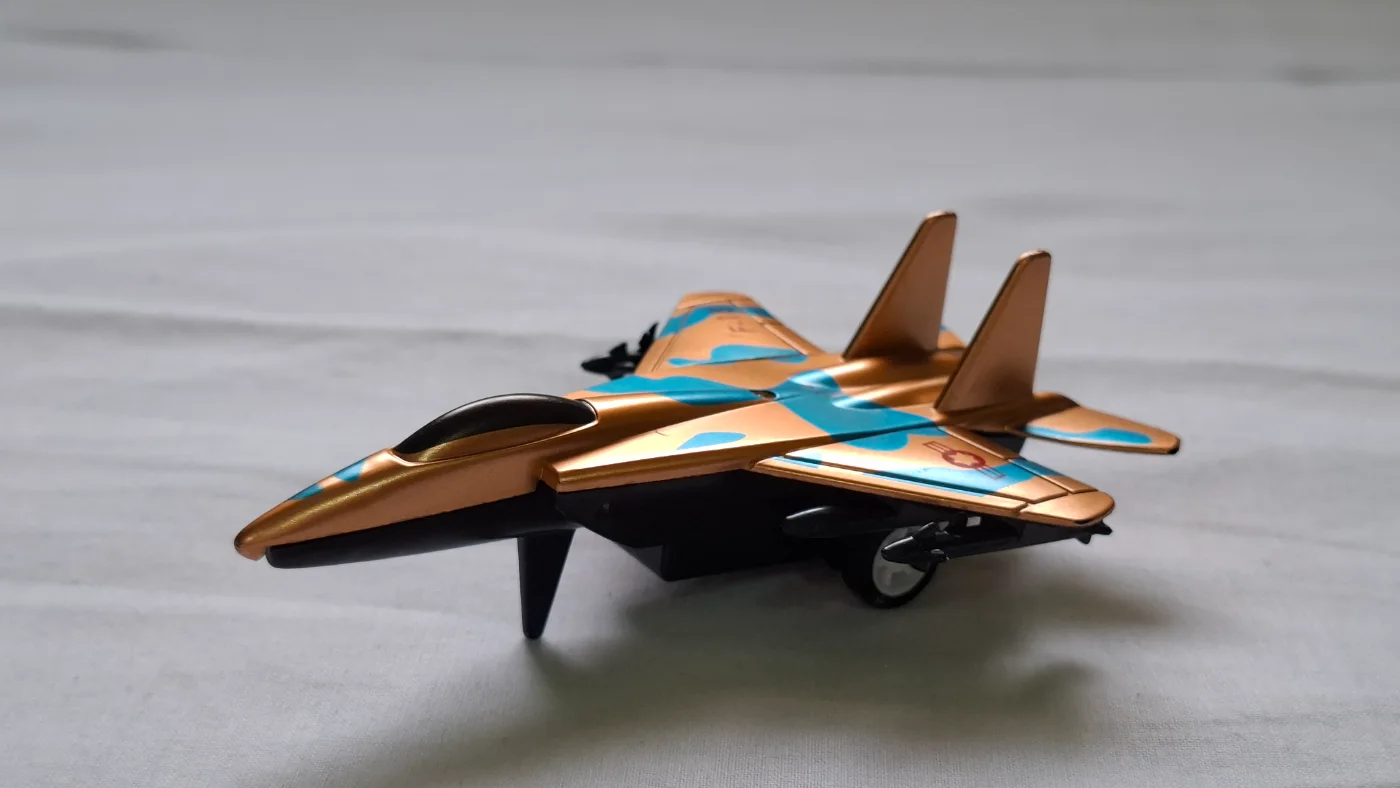 Toy Fighter Jet Airplane Model with Gold & Blue Camouflage Design