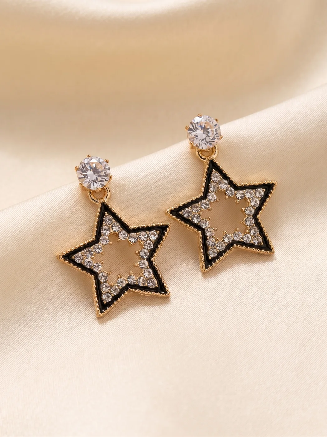 Gold Toned Star Dangle Earrings with Clear Stones