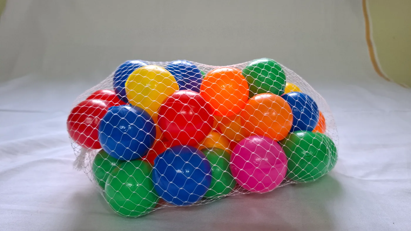 Colorful Plastic Play Balls for Kids - Assorted Colors in Net Bag