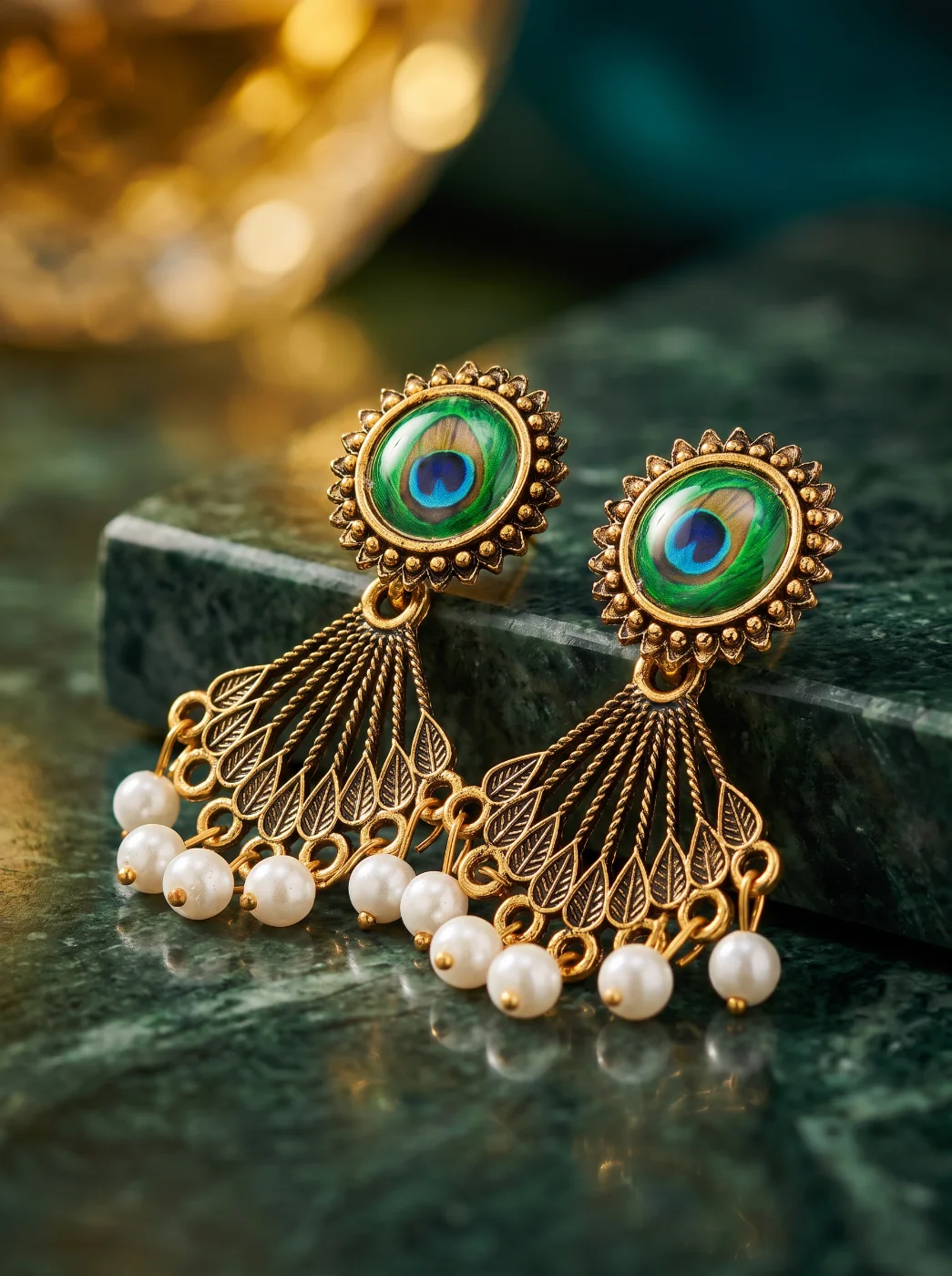Antique Gold Toned Peacock Feather Jhumka Earrings with Pearls